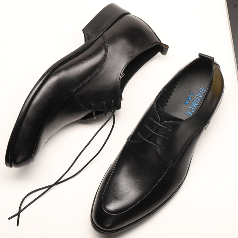 Formal British pointed leather business shoes with a sleek design, showcasing polished black leather and elegant style.