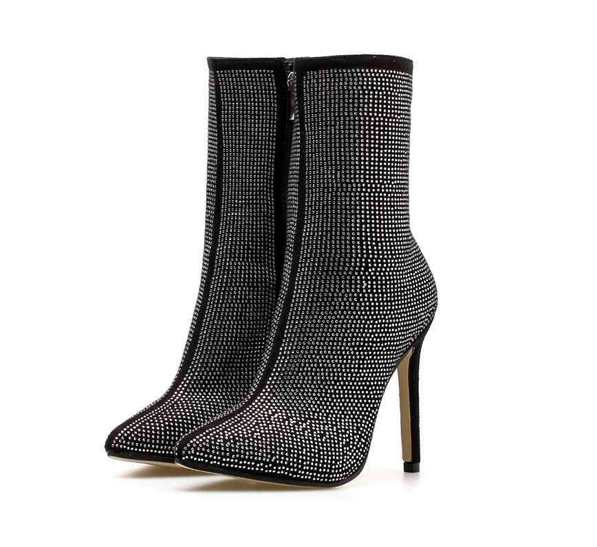 Rhinestone high heel boots featuring a pointed toe design, showcasing a stylish and glamorous footwear option.