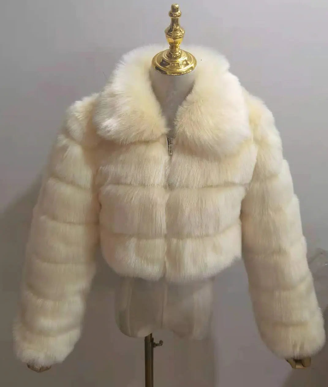 Faux fur women's short jacket with lapel and long sleeves, stylish and warm outerwear in soft, plush fabric.