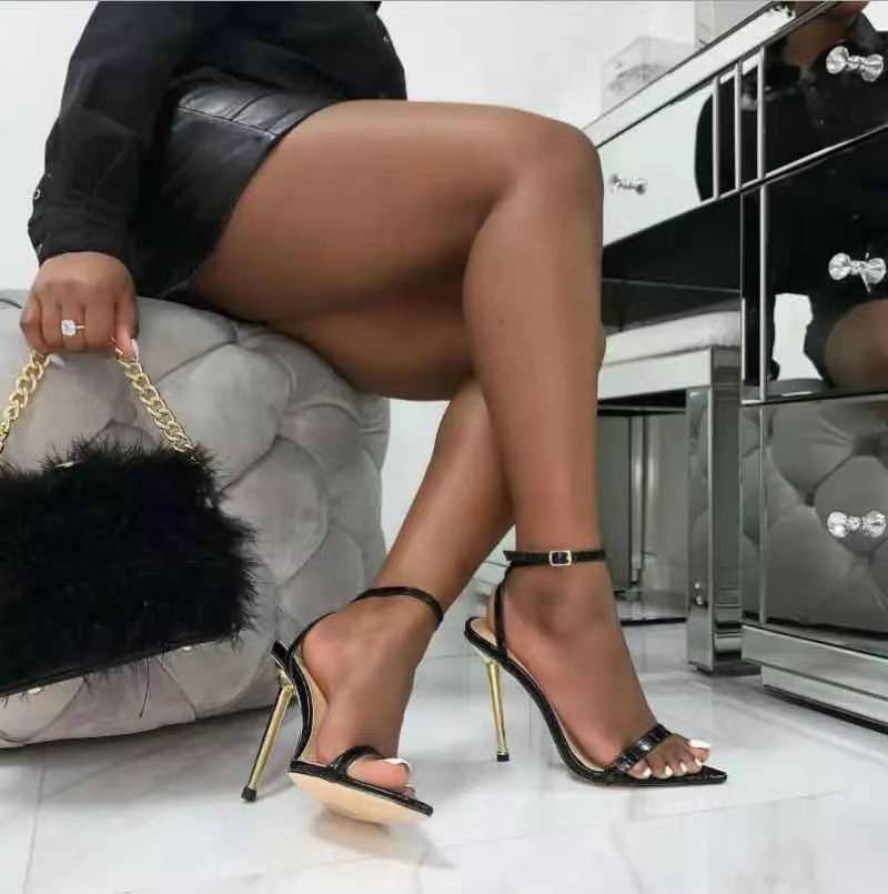 Pointed toe stiletto high heel sandals for women with sleek design and elegant silhouette in black leather finish.