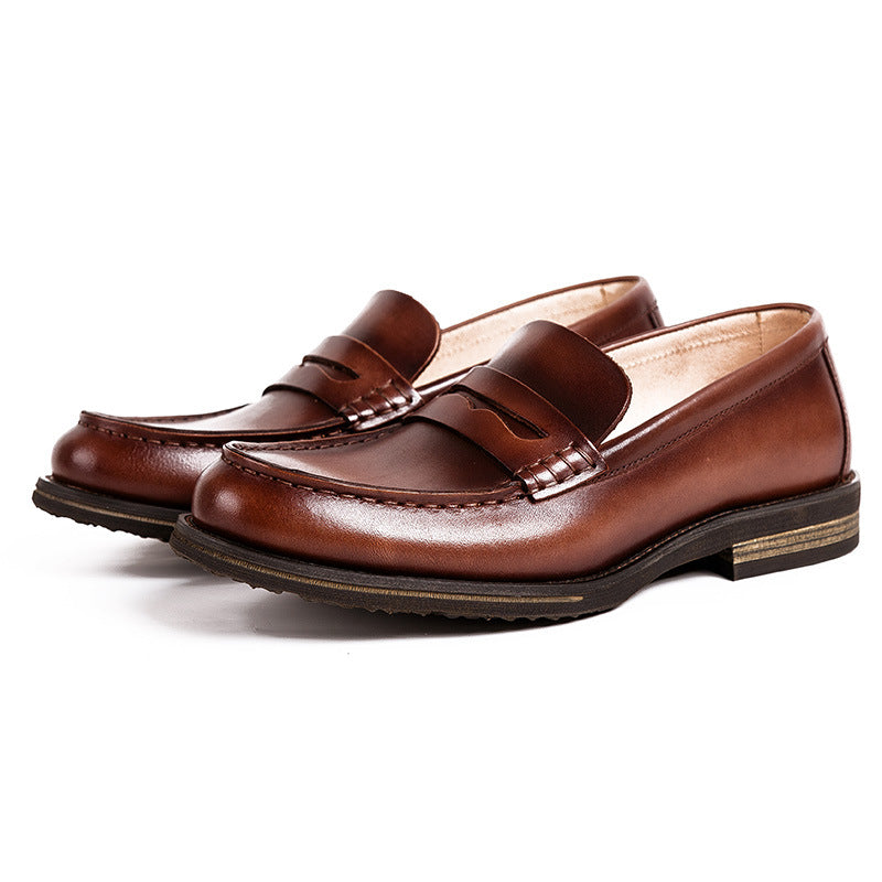 British casual men's cowhide leather loafers in a classic design, showcasing rich texture and stylish silhouette.