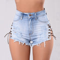 Plus size summer ripped denim shorts in light blue with frayed hems and pockets, perfect for casual outings.