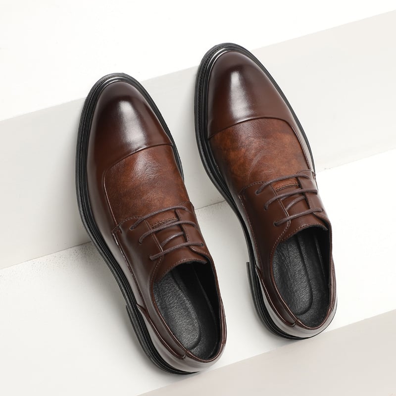 British style pointed business dress shoes in sleek black leather with a polished finish and elegant design.