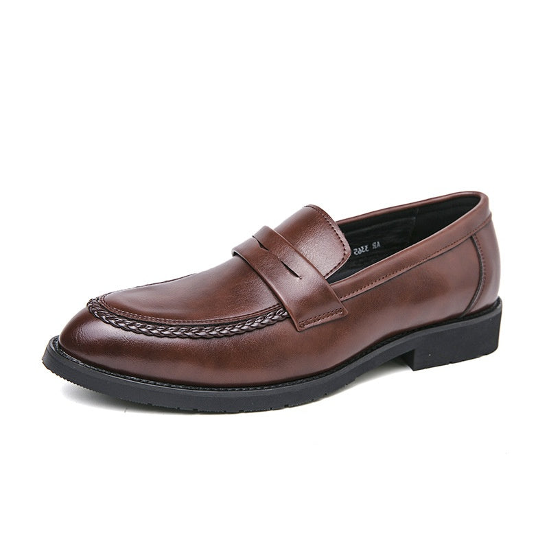 British casual men's cowhide leather loafers showcasing a sleek design and rich texture in a stylish setting.